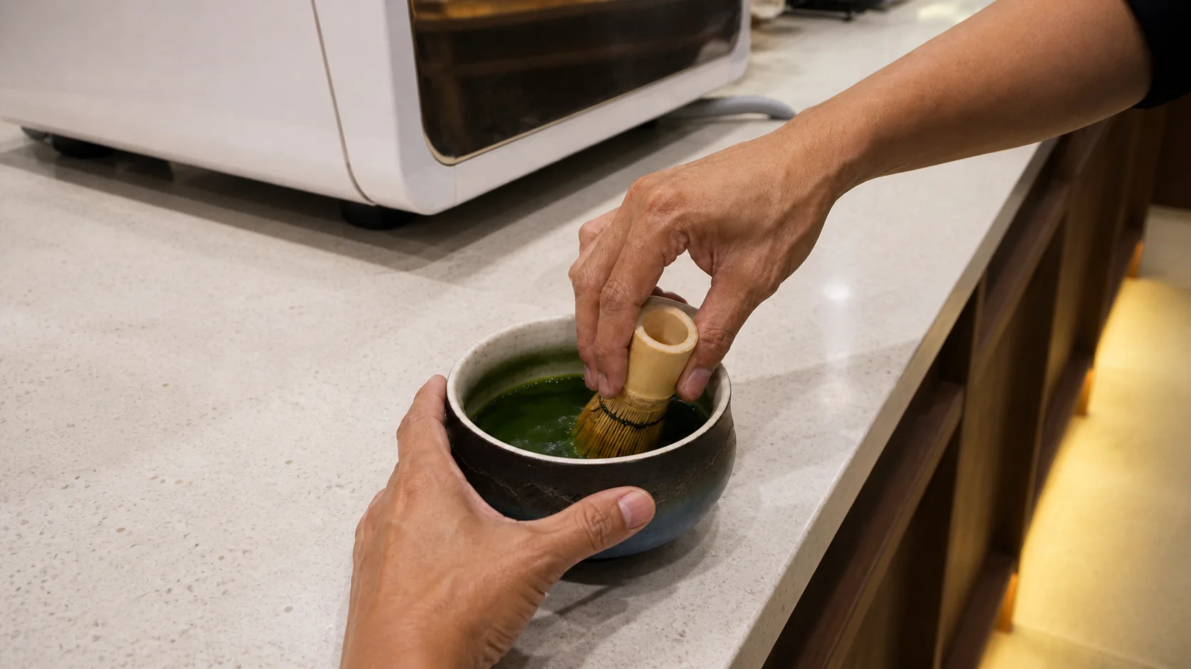 Matcha being whisked at the Willow Coffee counter